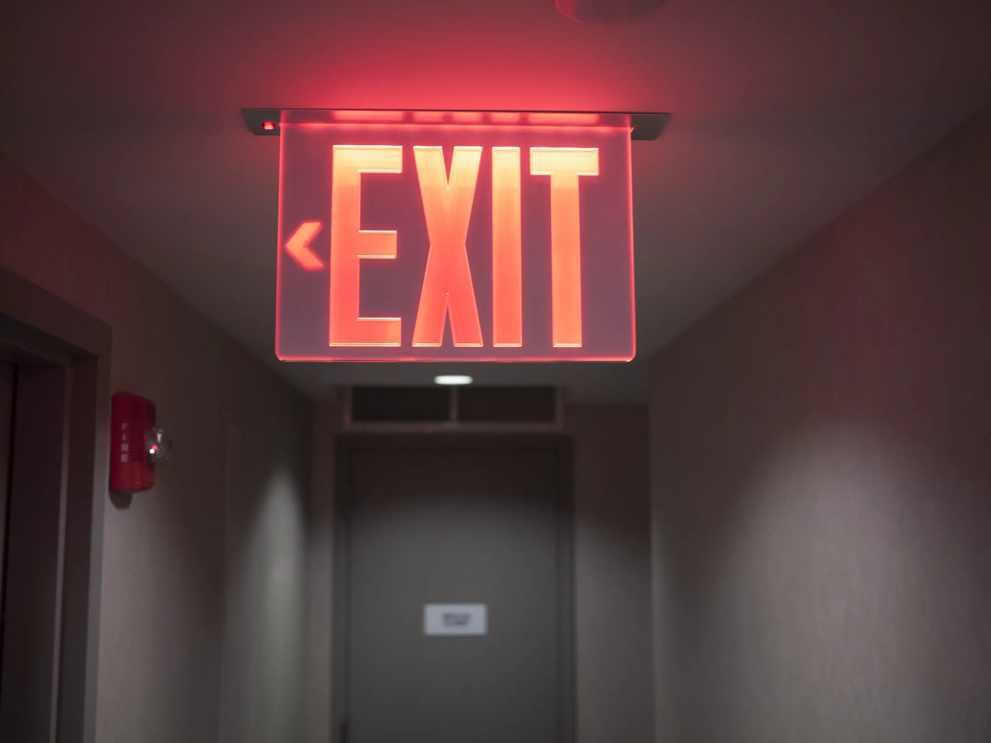 Illuminated exit sign in a commercial building