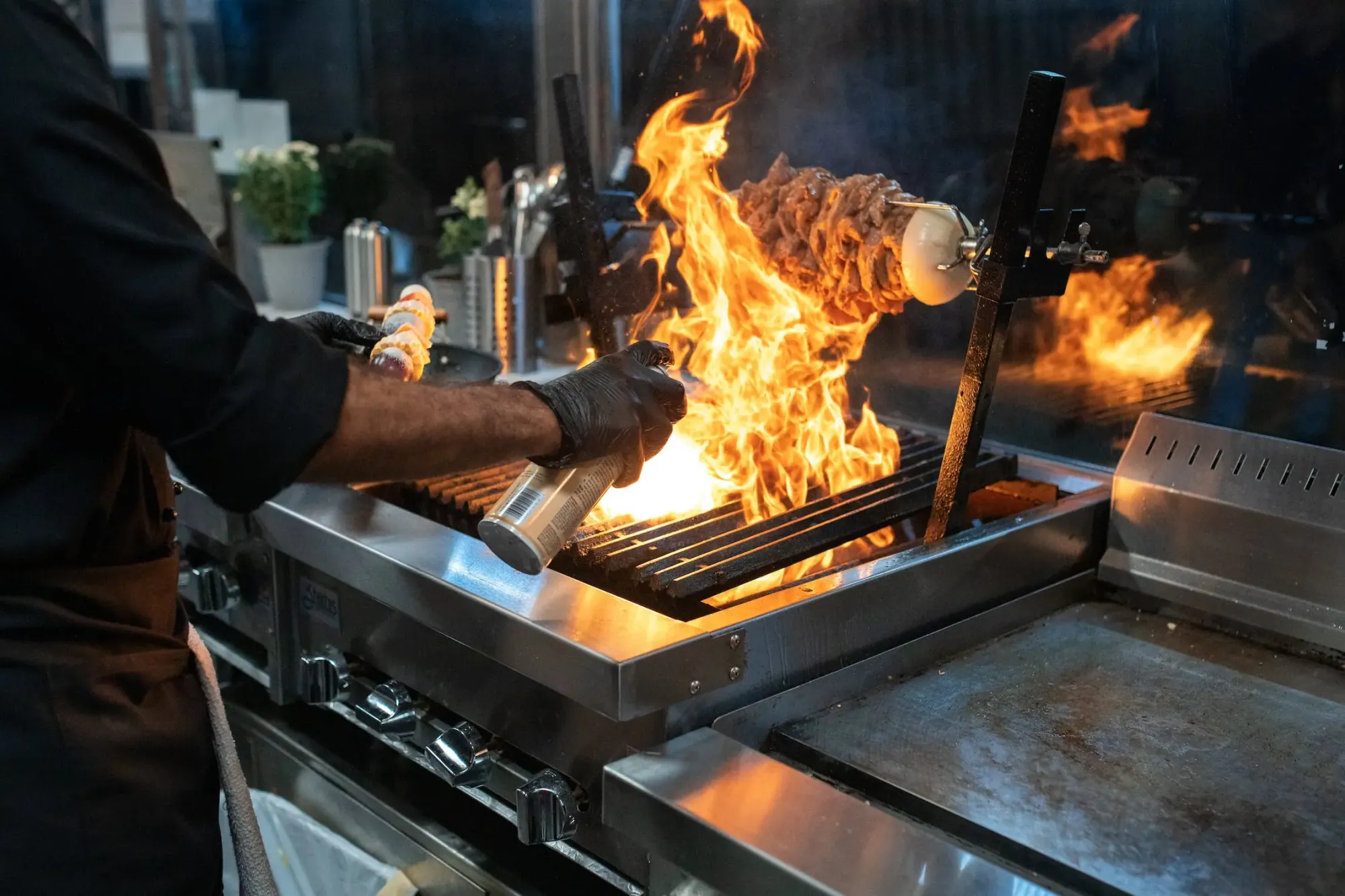 Commercial kitchen fire suppression system over cooking line